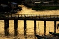 People Cross The Wood Bridge in Sunset, Nyaungshwe, Myanmar Royalty Free Stock Photo