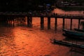 People Cross The Wood Bridge in Sunset, Nyaungshwe, Myanmar Royalty Free Stock Photo