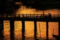 People Cross The Wood Bridge in Sunset, Nyaungshwe, Myanmar Royalty Free Stock Photo