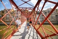 People crossing the bridge Royalty Free Stock Photo