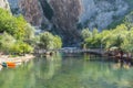 People crossing the bridge over the Buna river in Blagaj, Bosnia and Herzegovina Royalty Free Stock Photo