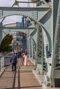 People crossing the historic steel Jiefang bridge in Tianjin