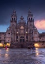 People is crossing the Obradoiro square in the final step of santiago pilgrimage path, making ghost shadows in this rainy day Royalty Free Stock Photo