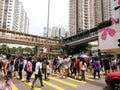 People crossing a pedestrian in Hong Kong