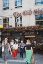 People crossing the road in front of The Old Ship pub in Richmond, London, UK. Royalty Free Stock Photo