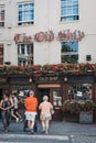 People crossing the road in front of The Old Ship pub in Richmond, London, UK. Royalty Free Stock Photo