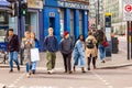 People crossing the road in London. People walking in downtown of London full of modern and traditional buildings, small and big Royalty Free Stock Photo