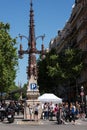 People are crossing road near vintage street light at Barcelona town Royalty Free Stock Photo