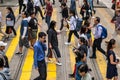 People crossing street in crowded shopping district of Hong Kong City Royalty Free Stock Photo