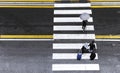 People crossing the street in a rainy day. Royalty Free Stock Photo