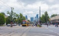 People crossing the street and the tram tracks in Warsaw, Poland. Royalty Free Stock Photo