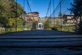 People crossing the suspension bridge of Rupit Royalty Free Stock Photo