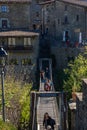 People crossing the suspension bridge of Rupit