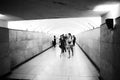 People crossing a tunnel at the Paris Metro