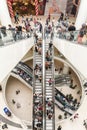 People Crowd On Escalators In Luxury Shopping Mall Royalty Free Stock Photo