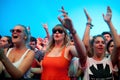 People from the crowd (fans) watch a concert at FIB Festival