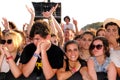 People from the crowd (fans) watch a concert at FIB Festival