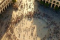 People crowd walking on around city square view from the top