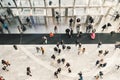 People crowd walking in the business centre and shopping mall entrance. View from the top. Royalty Free Stock Photo