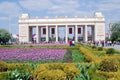 People crowds enter and leave Gorky park by the main entrance gates.