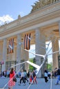 People crowds enter and leave Gorky park by the main entrance gates.