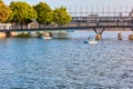 People cruising on pedalo boat over the St. Lawrence river in old port, Montreal, Quebec, Canada