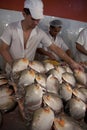 People cutting river fish in Amazon