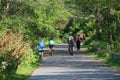 People cycling, Jogging and walking on the bikeway in the afternoon , Lexington, MA. USA. May 21, 2023