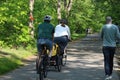 People cycling, Jogging and walking on the bikeway in the afternoon , Lexington, MA. USA. May 21, 2023