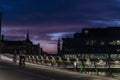 People cycling on Langebro at sunset in Copenhagen, Denmark