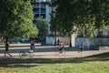 People cycling and running in London, UK, in summer