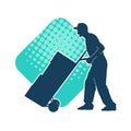 Silhouette of a male worker pushing lori wheels transporting carboard boxes. Royalty Free Stock Photo