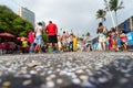 People dance, jump and play in the street during the pre-Carniva