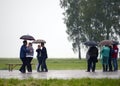 People dance in the rain on the Borodino field. Royalty Free Stock Photo