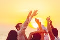 People dancing at the beach with hands up. concept about party, music and people Royalty Free Stock Photo