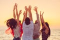 People dancing at the beach with hands up. concept about party, music and people Royalty Free Stock Photo