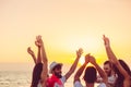 People dancing at the beach with hands up. concept about party, music and people Royalty Free Stock Photo