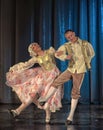 People dancing in traditional costumes on stage, Royalty Free Stock Photo