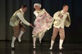 People dancing in traditional costumes on stage, Royalty Free Stock Photo