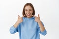 People at dentist. Smiling happy caucasian woman showing her perfect white smile, pointing at teeth and looking joyful Royalty Free Stock Photo