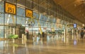 People in the departure area of Madrid Barajas Airport waiting for the flight. Royalty Free Stock Photo