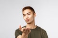 People, different expressions and lifestyle concept. Close-up portrait of coquettish, cheeky asian romantic guy, sending