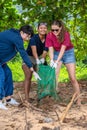Khao Lak, Thailand, 1 june 2019: People of different nationalities cleaning garbage on the black beach to clean the
