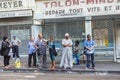 People of different nationalities wait at the bus stop in Marsei