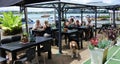 People dining in a cafe in Mangonui an historic fishing Northland New Zealand