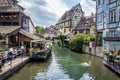 People dining near a river in a small village in France Royalty Free Stock Photo