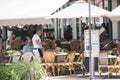 People dining on Ocean Drive Miami Beach FL summertime vacation