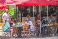 People dining on Ocean Drive Miami Beach FL summertime vacation