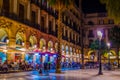 People dinning in a restaurant situated on the Placa Reial in Barcelona, Spain....IMAGE