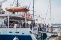 People disembarking Delos Tours Orca boat in Delos, Greece Royalty Free Stock Photo